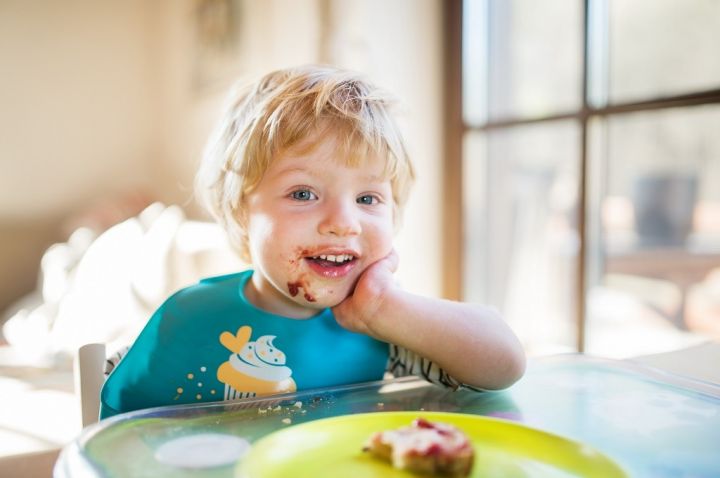 a-toddler-boy-eating-at-home-PGZ9M57.jpg