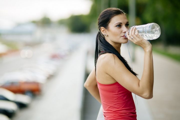 attractive-woman-drinking-water-XRWF4AY.jpg