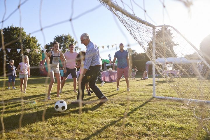 children-playing-football-match-with-father.jpg
