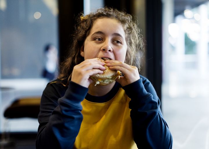 close-up-of-teenage-girl-eating-hamburger-obesity.jpg