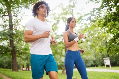couple-jogging-and-running-outdoors-in-nature-CQXJ76M.jpg