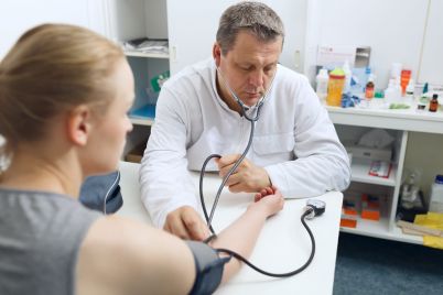 doctor-measures-the-blood-pressure-GCKJHL8-scaled.jpg