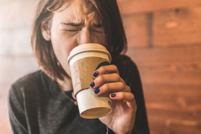 girl-cringing-at-hot-coffe-cup-500x366.jpg
