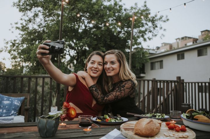 lesbian-couple-taking-a-selfie-B4CTQJL.jpg