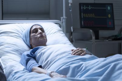 middle-aged-woman-with-cancer-dying-PQAP5ES.jpg