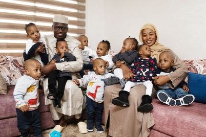 nonuplets-and-their-parents-sat-on-a-sofa-730589.jpg